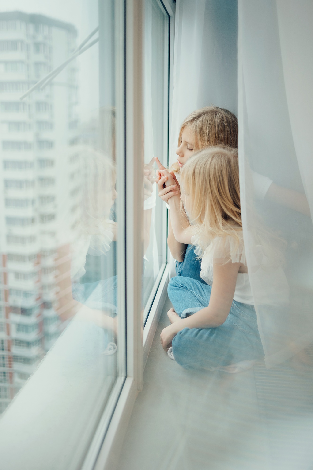 children look out the window