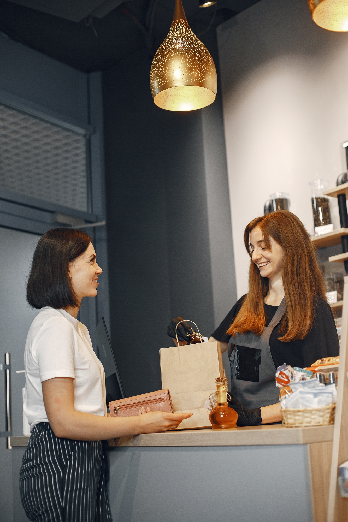 Woman pays for her purchase at the checkout